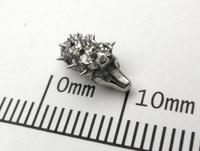 A 1 cm long hedgehog, with spikes.